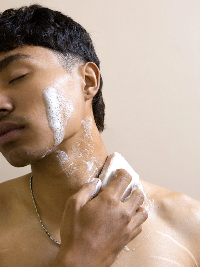 A man using mad honey soap as a skincare product